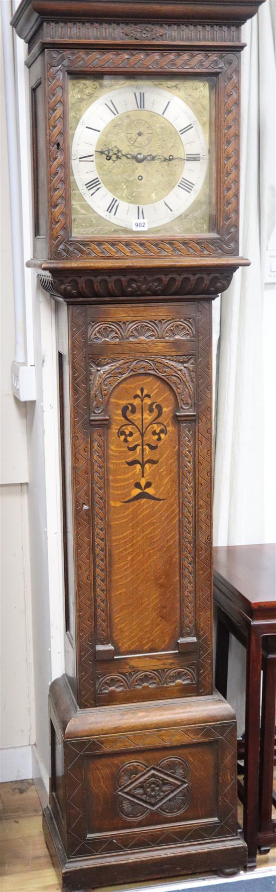A reproduction inlaid carved oak chiming longcase clock, marked Maple, London H.196cm